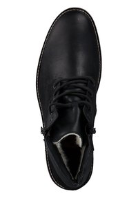 Stivaletto in pelle nera con design alla caviglia, dettagli in cucitura e morbido rivestimento in pelliccia visibile all'apertura, con punta arrotondata.