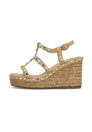 Beige wedge sandal with braided rope sole, ankle buckle strap, decorated with turquoise and gold studs along straps and sole.