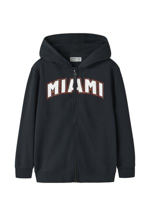 Black zip-up hoodie with hood and white block letters outlined in orange spelling "MIAMI" on the chest.