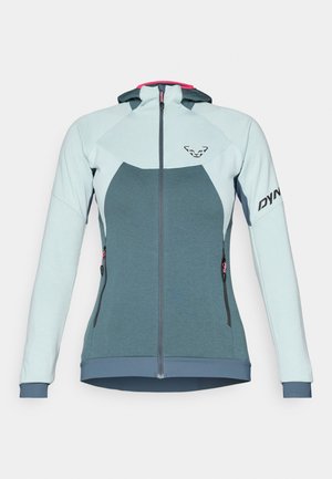 Kapucnis dzseki világoskék és türkiz színben, cipzáros elülső résszel, oldalsó zsebekkel, kontrasztos rózsaszín díszítéssel és logóval az ujjon.