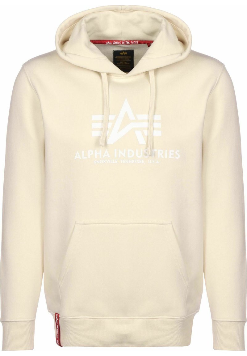 Bež hoodie napravljen od mekanog materijala, s prednjim džepom, vezicom i bijelim logoom s trakama. Crveni detalj na rubu.