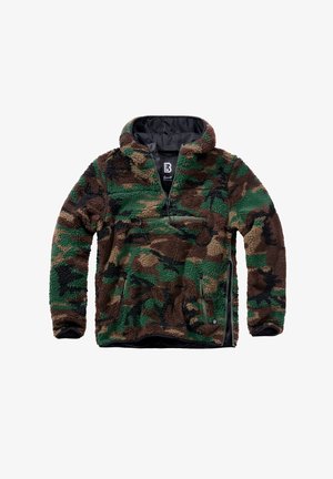 Kamouflage-kuvioinen vetoketjullinen paita, joka on valmistettu pehmeästä fleece-materiaalista vihreän ja ruskean sävyissä. Sisältää etupuolella vetoketjullisen taskun ja kiristysnauhat.