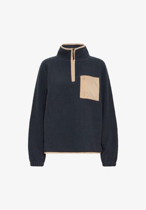 Navy blue fleece pullover with beige zipper trim, beige zippered chest pocket, elastic cuffs, and high collar.