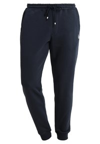 Navy blue sweatpants made from soft fabric, featuring an elastic waistband with adjustable drawstrings and ribbed cuffs at the ankles.