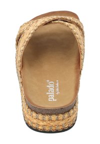 Woven straw slide sandal in tan, featuring a smooth, cushioned footbed, braided design, and a slightly raised heel with metallic accents.