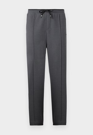 Sorte teksturerede sweatpants med elastisk talje og snor, der har sidelommer og tætsiddende ben for en strømlinet pasform.