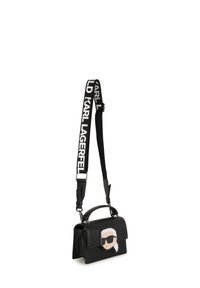 Borsa a tracolla nera in materiale sintetico con manico e tracolla regolabile, caratterizzata da un bold "Karl Lagerfeld". Sul davanti è presente un'icona di una figura con occhiali da sole.