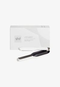 Lisseur de cheveux sans fil en blanc et noir, présentant un design épuré, des plaques en céramique lisses et une forme compacte, avec une boîte fournie.
