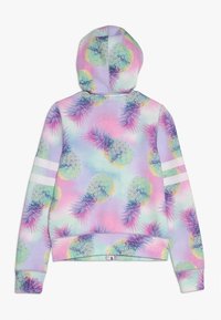 Sweat à capuche dans des couleurs pastel, avec un motif d'ananas. Tissu doux, design court, accents rayés blancs sur les manches.