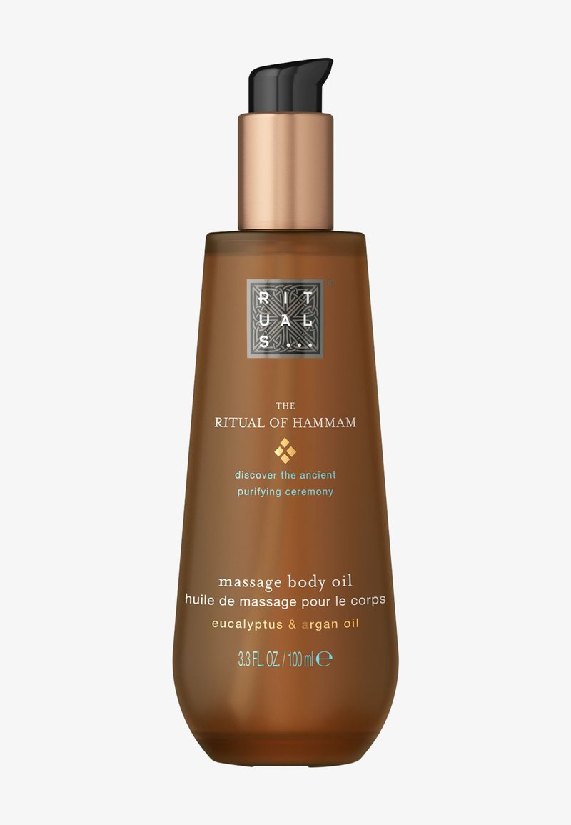 Fles Ritual of Hammam massage lichaamsolie met eucalyptus en arganolie, 100 ml, bruin met zwarte en gouden pompdispenser.