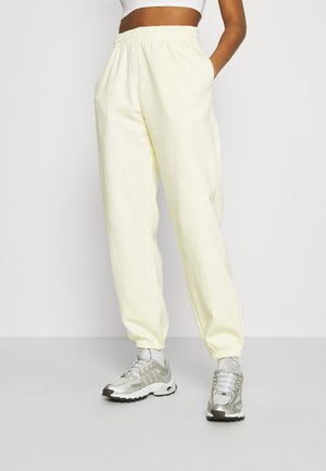 CORINNA - Pantalones deportivos - lemon