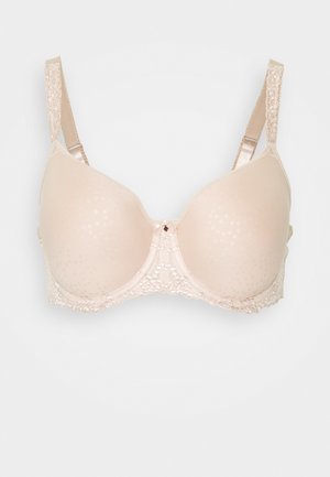 Beige beha met gladde voorgevormde cups, bloemige kantafwerking aan de onderrand, verstelbare bandjes en een klein decoratief detail in het midden.