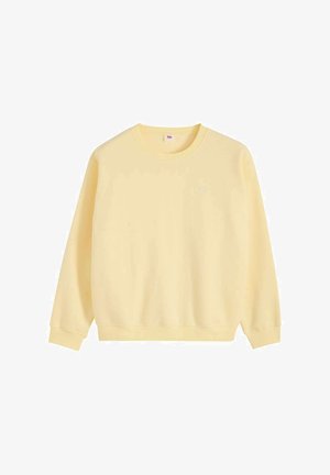 Jasnożółta bluza z okrągłym dekoltem, długimi rękawami oraz prążkowanymi ściągaczami na rękawach i u dołu, prezentowana na jednolitym białym tle.