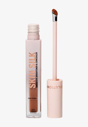 Illuminateur et concealer pour le contour des yeux dans un tube transparent avec un liquide orange foncé, doté d'un applicateur rose et d'un design minimaliste.