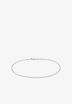 Delikat sølvkjede med små ovale lenker og en rektangulær lås inngravert med "SEIZMONT" på hvit bakgrunn.