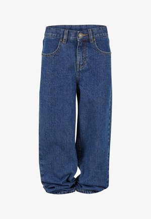 Siniset farkut rentoilla leikkauksilla, jotka sisältävät napin sulkemisen, viisi taskua, näkyvää ompelua ja kevyttä kapenevuutta nilkoissa.