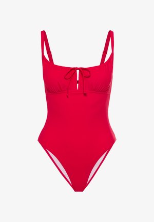Badeanzug aus einem Stück in leuchtendem Rot. Mit verstellbaren Trägern, gerafftem Dekolleté, vorderem Bindedetail und hochgeschnittenen Beinen mit weißen Akzenten.