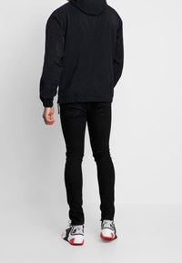 Nike Sportswear Vindjacka - black