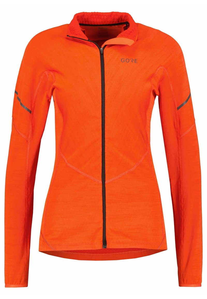 Pomarańczowa kurtka z długim rękawem, z zamkiem z przodu, teksturowany materiał, czarny zamek i akcenty oraz profilowane szwy dla dopasowanego kroju.