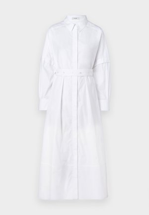 Rochie albă cu mâneci lungi, cu front cu nasturi, curea strânsă în talie și croială lejeră. Fabricată dintr-un material neted și ușor.