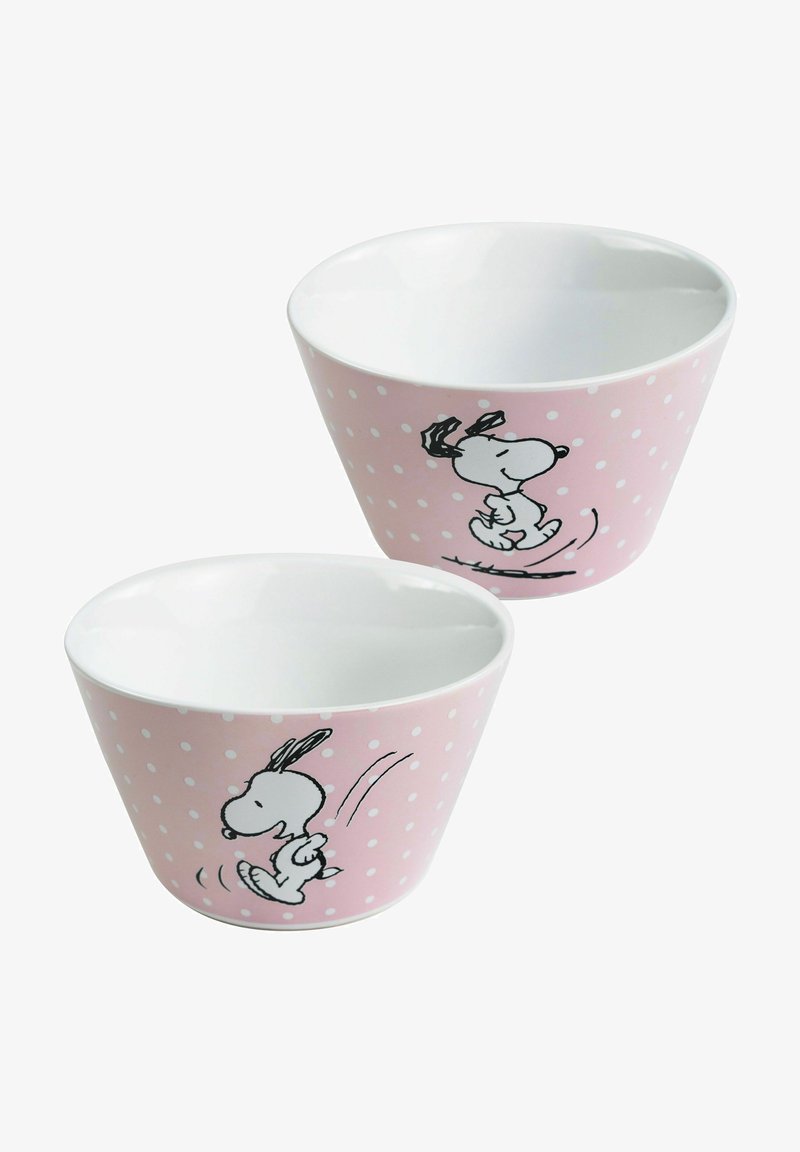 Keramikschalen mit einem pinken Punktmuster, die eine schwarz gezeichnete Cartoonfigur zeigen. Glatte weiße Innenseite, konische Form, im Set von zwei.