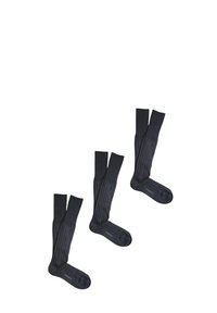 Calze grigio scuro a ginocchio con texture a coste e punta rinforzata. Presentano una finitura liscia e un dettaglio con logo sulla parte inferiore del piede.