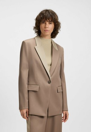Beige tailored blazer with light beige narrow shawl lapels, single button closure, two front pockets, made from smooth, structured fabric.