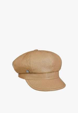 Light brown perforated leather newsboy cap with small metallic logo pin on side and short curved brim.