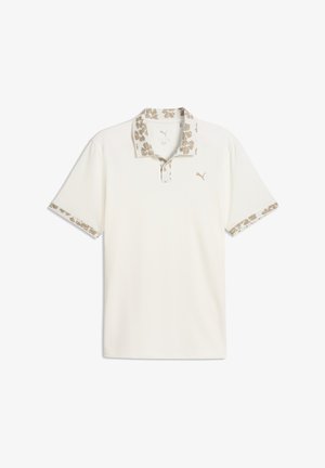 Polo blanco con cuello y puños de manga con estampado floral, que presenta un logo de PUMA en el pecho en un tono beige sutil.