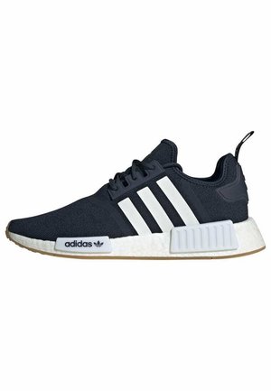 Navy sneaker with white three-stripe design, mesh upper, rubber sole, and a textured accent on the heel. Features a cushioned midsole.