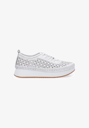 White lace-up shoes with perforated upper design, padded collar, and textured rubber sole. Features a stitched detailing along the edges.