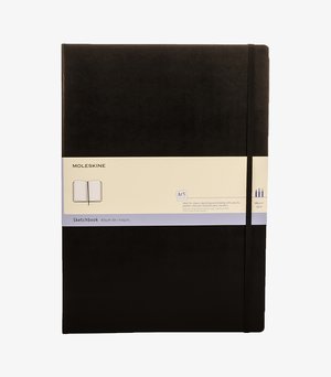 Black Moleskine sketchbook with elastic band, 165 gsm paper, labeled for sketching with pencils, pastels, charcoal, and markers.