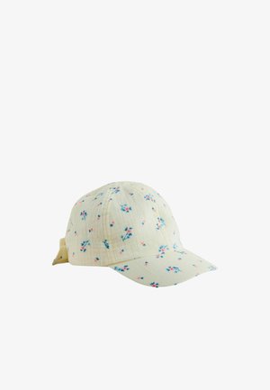 Lysegul baseball cap med et lille blåt og pink blomster mønster og en stofstrop bagpå.