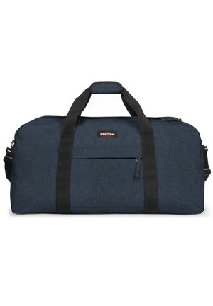 Durable navy blue duffel bag with black straps, a front zip pocket, and a rectangular shape. Made of textured fabric.品牌标志在袋子上。