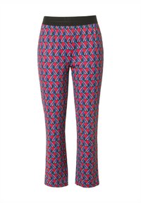 Leggings con un vibrante patrón que presenta formas geométricas en rojo, azul y negro. Cintura elástica y longitud recortada. Textura suave.