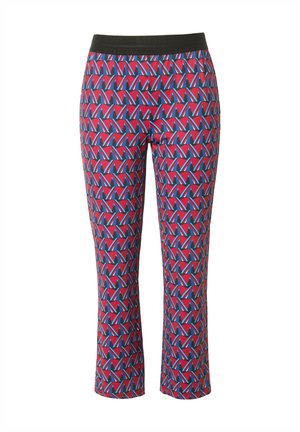 Leggings med ett livligt mönster som visar röda, blå och svarta geometriska former. Elastisk midja och kort längd. Slät yta.