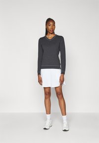 Kjus WOMEN KICKI V NECK  - Svetrík - black