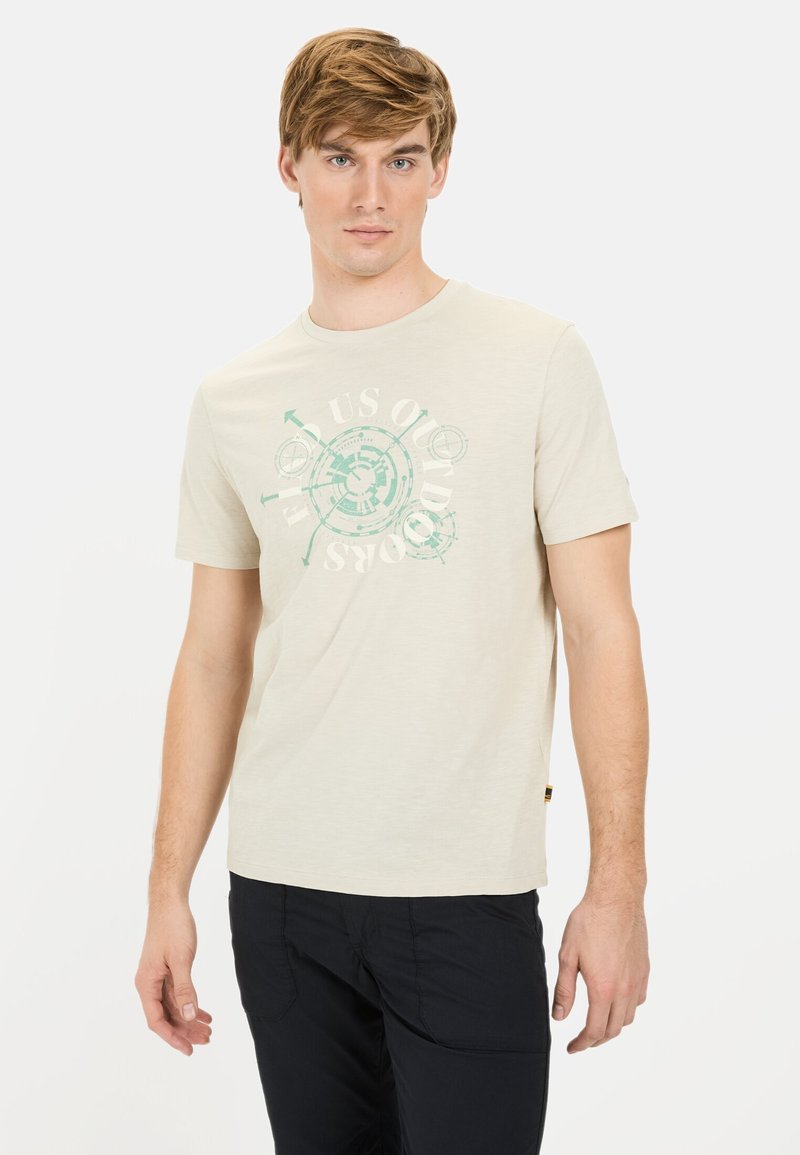 Helles beiges T-Shirt aus einem weichen Baumwollmix mit kurzen Ärmeln. Im Mittelpunkt befindet sich ein türkisfarbenes Grafikdesign. Rundhalsausschnitt, lockerer Schnitt.