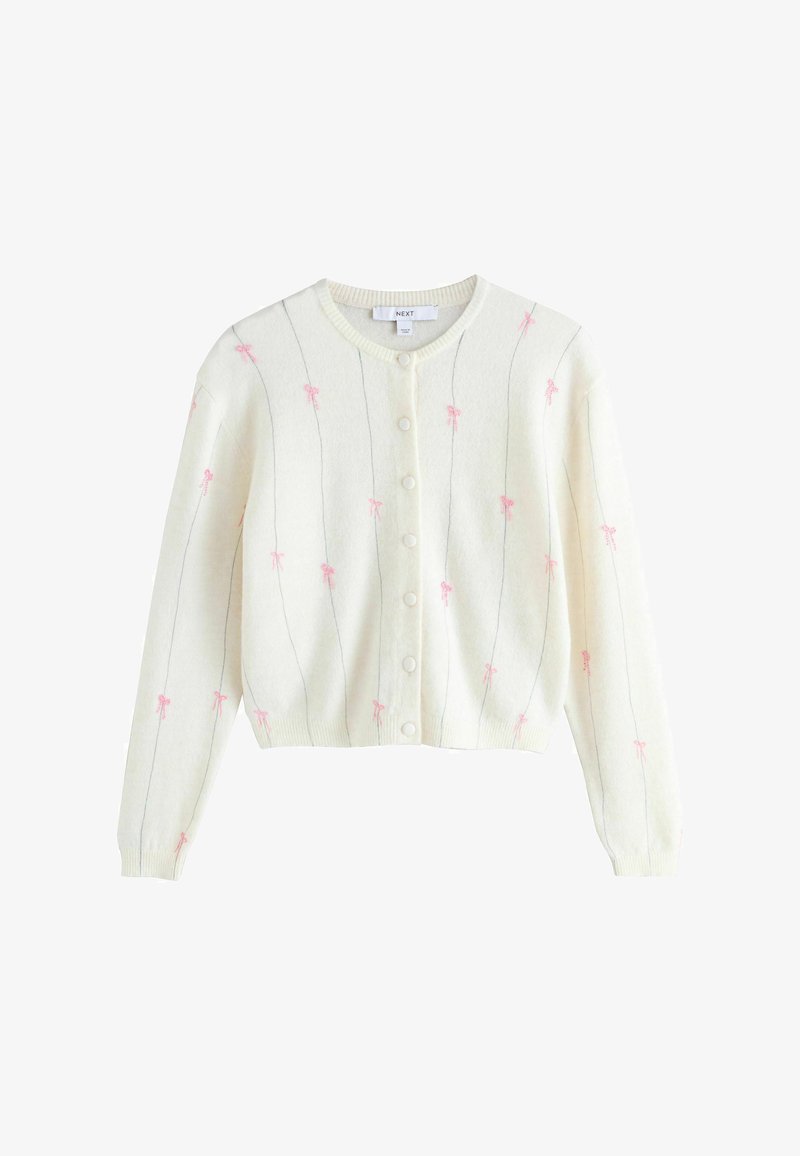 Valge kardigan pikkade varrukatega, ees nupud, õhukesed vertikaalsed hallid triibud ja kangal laiali laotatud väikesed roosad lipsukesed.