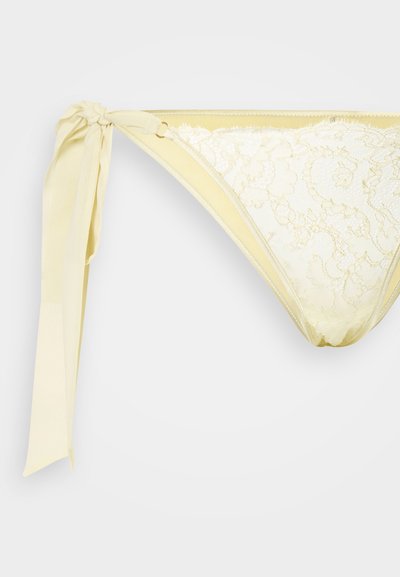 Κίτρινο κάτω μέρος μπικίνι με δαντελένιες λεπτομέρειες, δεσίματα στο πλάι σε κόμπο και απαλή υφή. Διαθέτει σχέδιο χαμηλής μέσης και λεπτό σχέδιο.