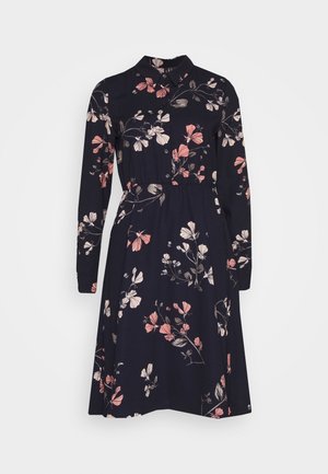 Robe-chemise bleu marine à manches longues avec col, motif floral rose et beige, taille cintrée et boutonnage sur le devant.