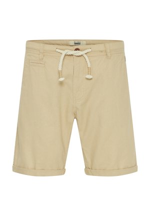 Beige shorts with a drawstring waist, rolled cuffs, and a single back pocket. Made of lightweight fabric with a smooth texture.