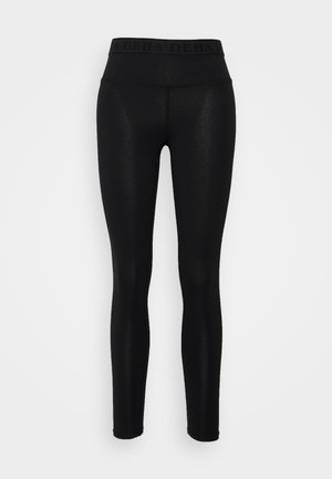 Sorte leggings lavet af strækstof, med en bred elastisk talje med præget brandnavn og en tætsiddende pasform.