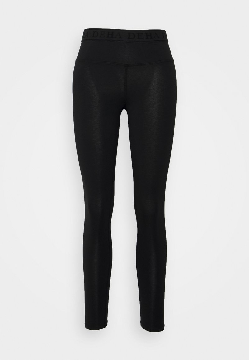 Leggings neri realizzati in tessuto elasticizzato, caratterizzati da un'ampia vita elasticizzata con nome del brand impresso e un design aderente.