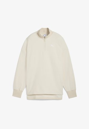 Pullover crema a zip fino al quarto realizzato in tessuto testurizzato, con polsini a costine e un piccolo logo bianco sul petto.