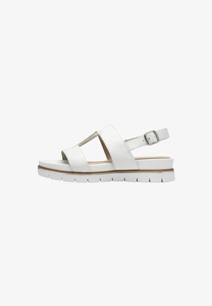 White sandal with cross straps and a buckle. Features a cushioned sole and textured accents. Overall design is lightweight and streamlined.