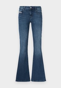 Σκούρα μπλε τζιν με καμπάνα, στενή μέση, σχεδίαση με πέντε τσέπες, ελαφριά ξεθωριάσματα στους μηρούς και μεταλλικό κουμπί στο κλείσιμο της μέσης.