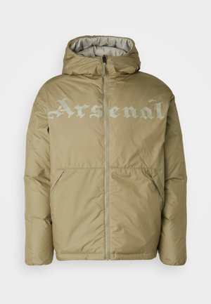 Beige puffer jacket with a hood, featuring a front zipper and large "Arsenal" text in light gray across the chest. Two side pockets.