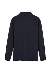 Mörkblå pikétröja med långa ärmar och krage. Slät tyg, avslappnad passform och sydda manschetter. Minimalistisk design utan synlig logotyp eller mönster.