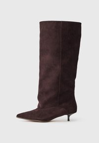 Pointed-toe knee-high boots in dark burgundy suede, featuring a slim kitten heel and seamless construction with a subtle texture.